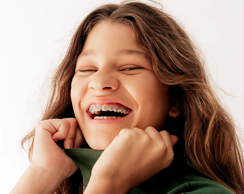 Smiling teen orthodontic patient with braces in Las Vegas